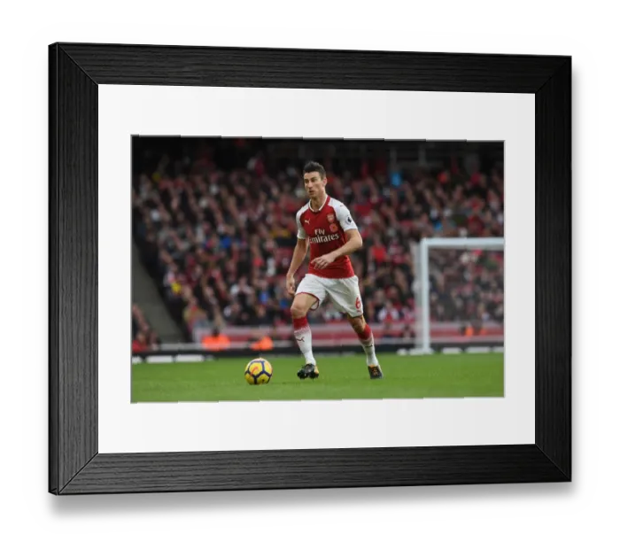 Framed Print : Arsenal's Koscielny in Action against Swansea City (2017-18) Framed Print : Arsenal's Koscielny in Action against Swansea City (2017-18)