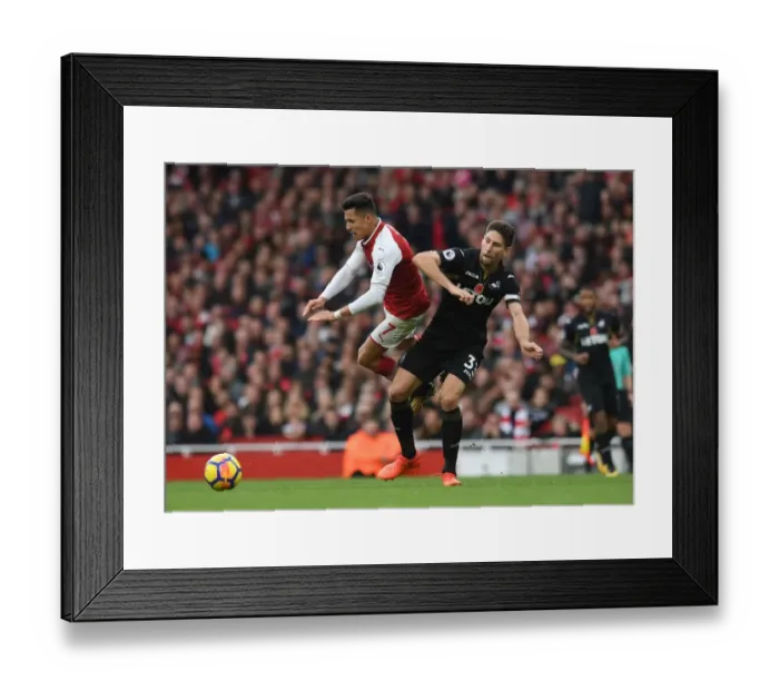 Framed Print : Arsenal's Alexis Sanchez Fouls by Swansea's Federico Fernandez (2017-18) Framed Print : Arsenal's Alexis Sanchez Fouls by Swansea's Federico Fernandez (2017-18)