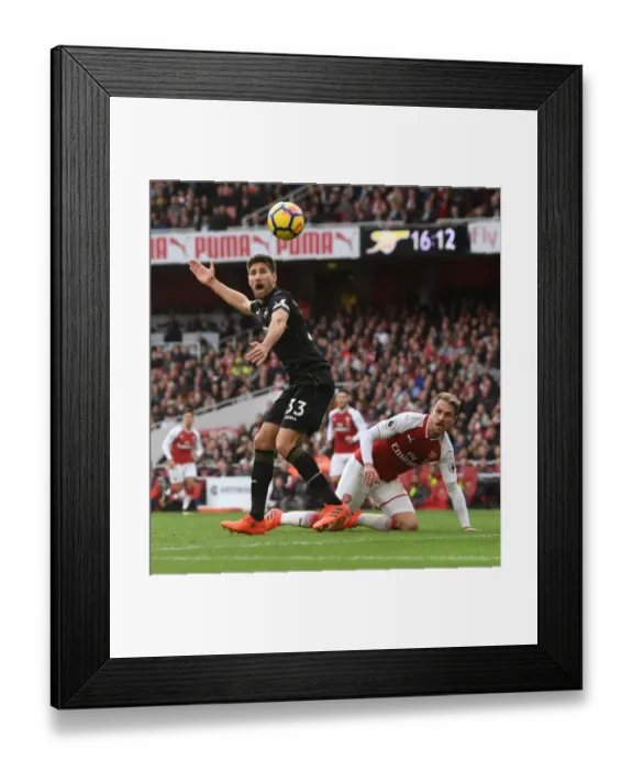 Framed Print : Clash at the Emirates: Ramsey vs. Fernandez in Arsenal's Battle Against Swansea City Framed Print : Clash at the Emirates: Ramsey vs. Fernandez in Arsenal's Battle Against Swansea City