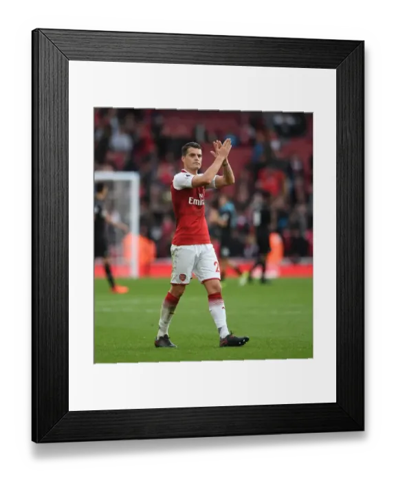 Framed Print : Arsenal's Granit Xhaka Celebrates with Fans after Victory over Swansea City Framed Print : Arsenal's Granit Xhaka Celebrates with Fans after Victory over Swansea City