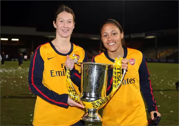 Ciara Grant and Alex Scott (Arsenal) with the league cup trophy