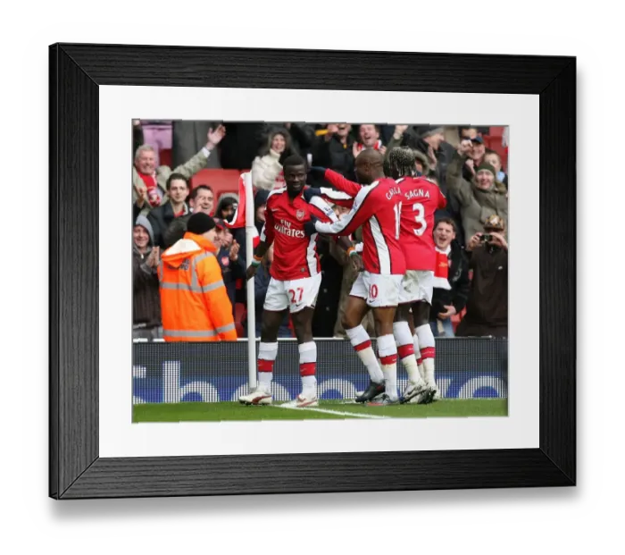 Framed Print : Emmanuel Eboue celebrates scoring the 3rd Arsenal goal