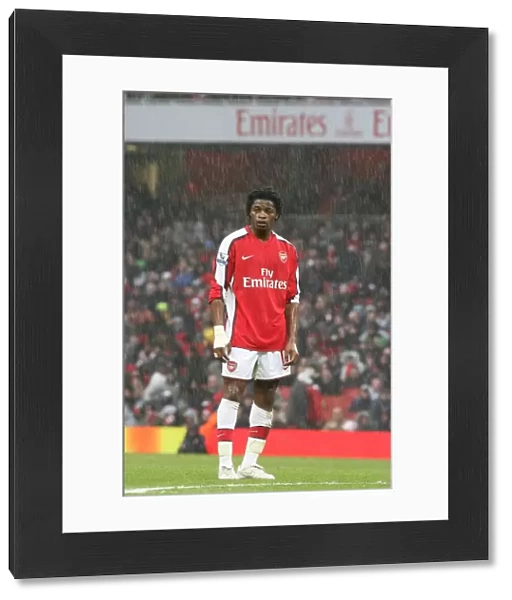 Alex Song (Arsenal) stands in the rain