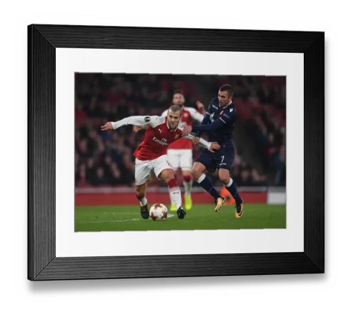 Framed Print : Arsenal's Jack Wilshere Clashes with Crvena Zvezda's Nenad Krsticic in Europa League Showdown Framed Print : Arsenal's Jack Wilshere Clashes with Crvena Zvezda's Nenad Krsticic in Europa League Showdown