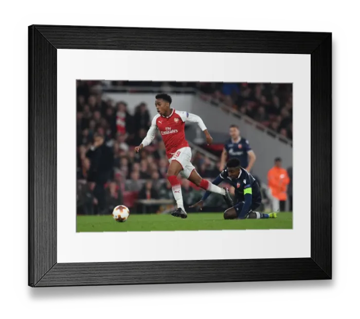 Framed Print : Arsenal's Joe Willock Clashes with Crvena Zvezda's Mitchell Donald in Europa League Showdown Framed Print : Arsenal's Joe Willock Clashes with Crvena Zvezda's Mitchell Donald in Europa League Showdown