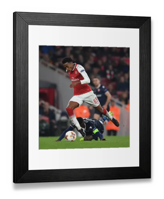 Framed Print : Clash of Midfielders: Joe Willock vs. Mitchell Donald in Arsenal's Europa League Battle Framed Print : Clash of Midfielders: Joe Willock vs. Mitchell Donald in Arsenal's Europa League Battle