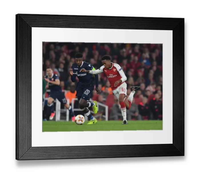 Framed Print : Arsenal's Joe Willock vs. Mitchell Donald: A Europa League Battle