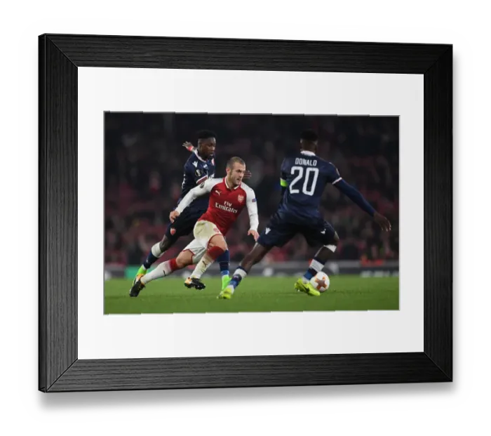 Framed Print : Arsenal's Jack Wilshere Clashes with Red Star's Richmond Boakye and Mitchell Donald during Europa League Match Framed Print : Arsenal's Jack Wilshere Clashes with Red Star's Richmond Boakye and Mitchell Donald during Europa League Match