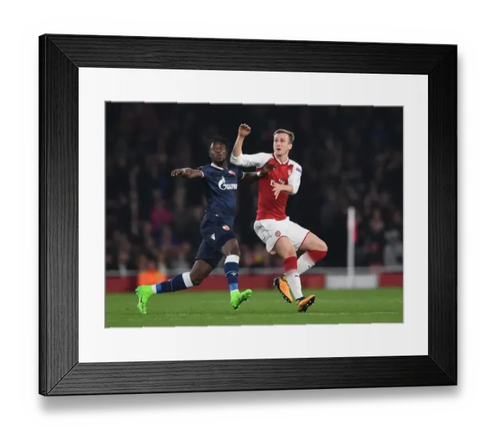 Framed Print : Rob Holding's Determined Stand Against Richmond Boakye in Europa League Clash