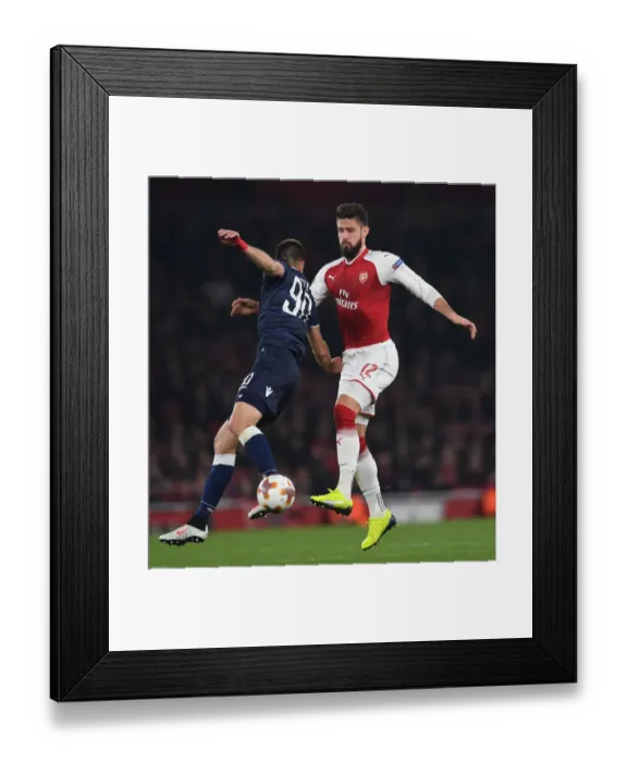 Framed Print : Giroud vs. Savic: A Europa League Showdown at Emirates Stadium