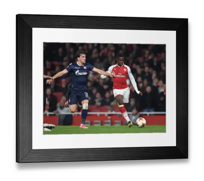 Framed Print : Intense Showdown: Eddie Nketiah vs. Filip Stocjkovic in Arsenal's Europa League Battle