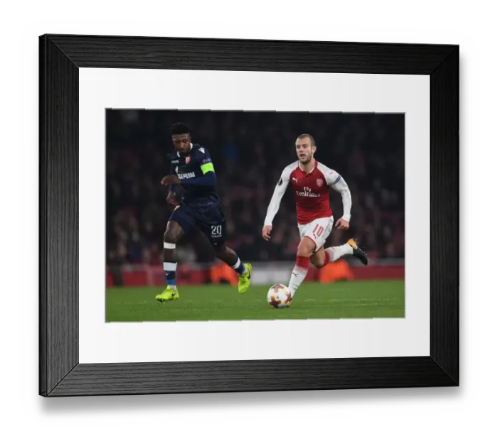 Framed Print : Arsenal's Jack Wilshere vs. Richmond Donald: Europa League Clash at Emirates Stadium Framed Print : Arsenal's Jack Wilshere vs. Richmond Donald: Europa League Clash at Emirates Stadium