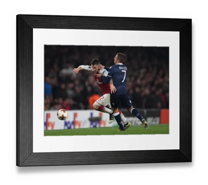 Framed Print : Arsenal's Debuchy Clashes with Red Star's Krsticic in Europa League Showdown Framed Print : Arsenal's Debuchy Clashes with Red Star's Krsticic in Europa League Showdown