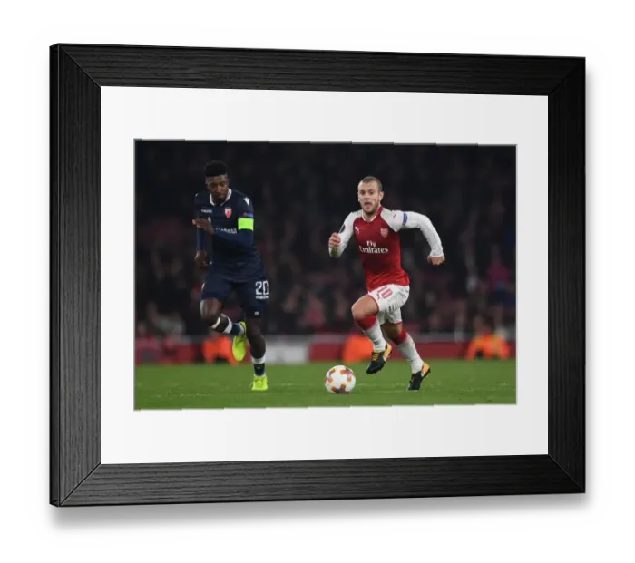 Framed Print : Arsenal's Jack Wilshere Faces Off Against Richmond Donald in Europa League Clash