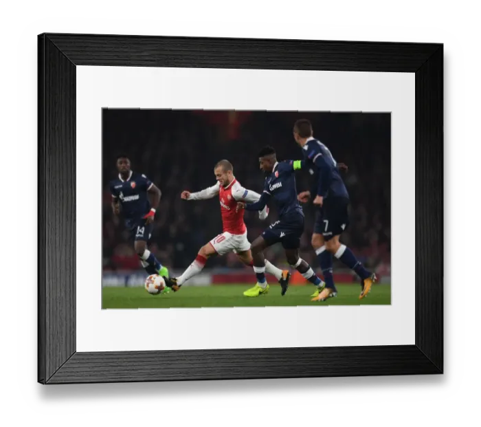 Framed Print : Jack Wilshere vs. Richmond Donald: Arsenal's Clash in Europa League Action