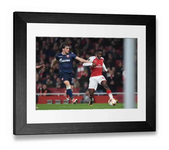 Framed Print : Arsenal's Eddie Nketiah Clashes with Crvena Zvezda's Filip Stocjkovic in Europa League Showdown Framed Print : Arsenal's Eddie Nketiah Clashes with Crvena Zvezda's Filip Stocjkovic in Europa League Showdown