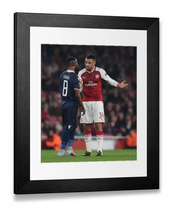 Framed Print : Arsenal's Coquelin Engages with Red Star's Kanga during Europa League Clash