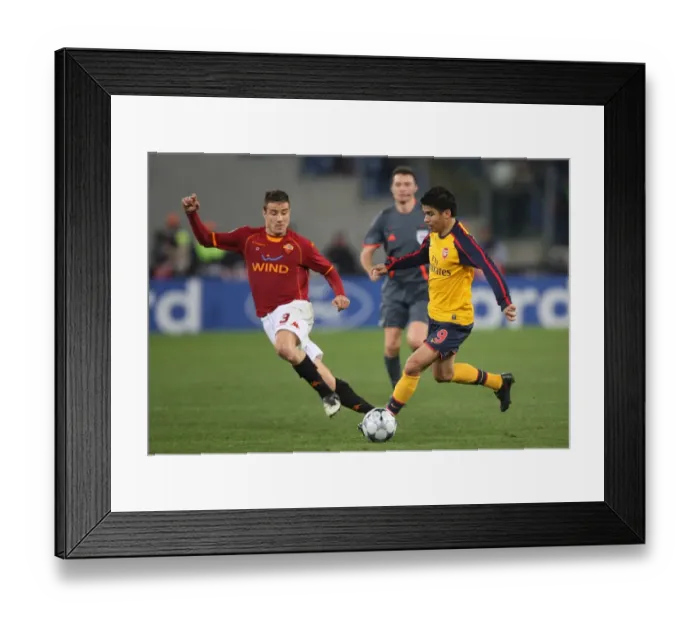 Framed Print : The Thrilling Penalty Shootout: Arsenal's Eduardo vs. Roma's Matteo Brighi in the UEFA Champions League
