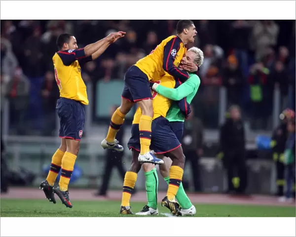 Manuel Almunia and Arsenal Teammates Celebrate Penalty Shootout Victory over AS Roma in UEFA Champions League