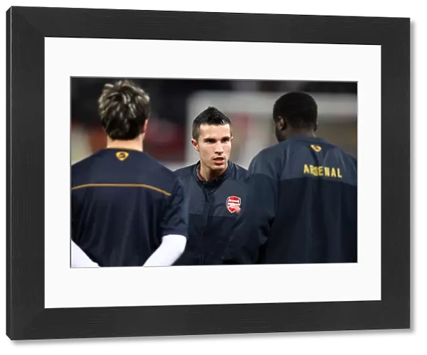 Robin van Persie (Arsenal) talks to the players before the match