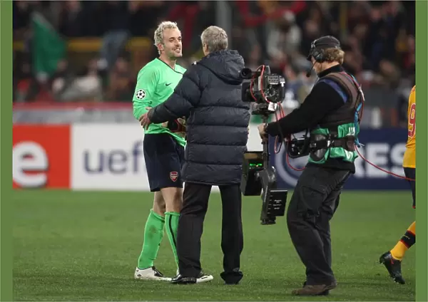 Manuel Almunia and Arsenal manager Arsene Wenger celebrate