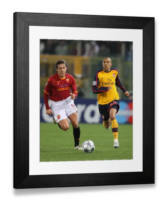 Framed Print : Clash of Titans: Gael Clichy vs. Rodrigo Taddei - Dramatic UEFA Champions League Showdown at Stadio Olympico (11 / 3 / 2009): Arsenal's Gael Clichy and Roma's Rodrigo Taddei Go Head-to-Head in a Thrilling 1:0 Second Leg Battle Decided by Penalties