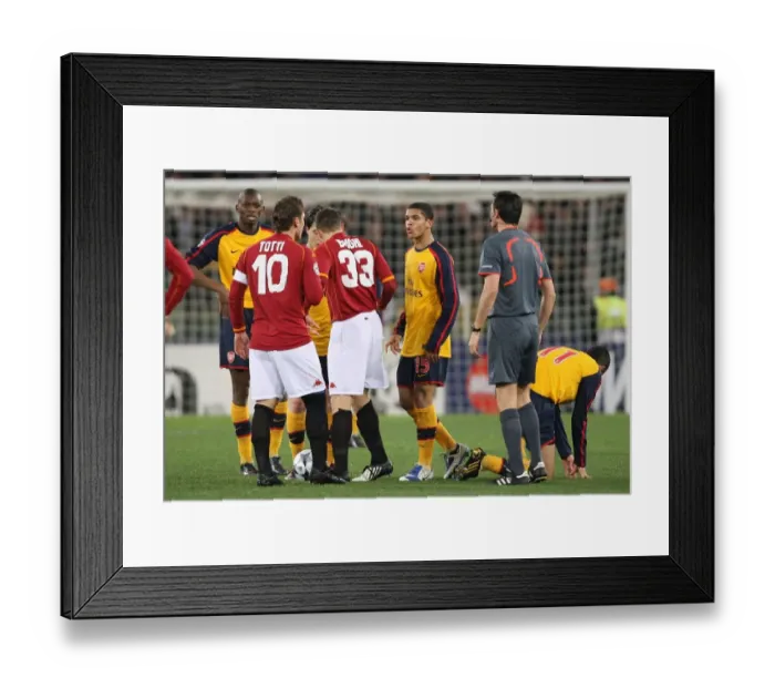 Framed Print : Denilson vs. Totti: Clash in the UEFA Champions League Showdown at Stadio Olympico, Arsenal vs. AS Roma (2009) Framed Print : Denilson vs. Totti: Clash in the UEFA Champions League Showdown at Stadio Olympico, Arsenal vs. AS Roma (2009)