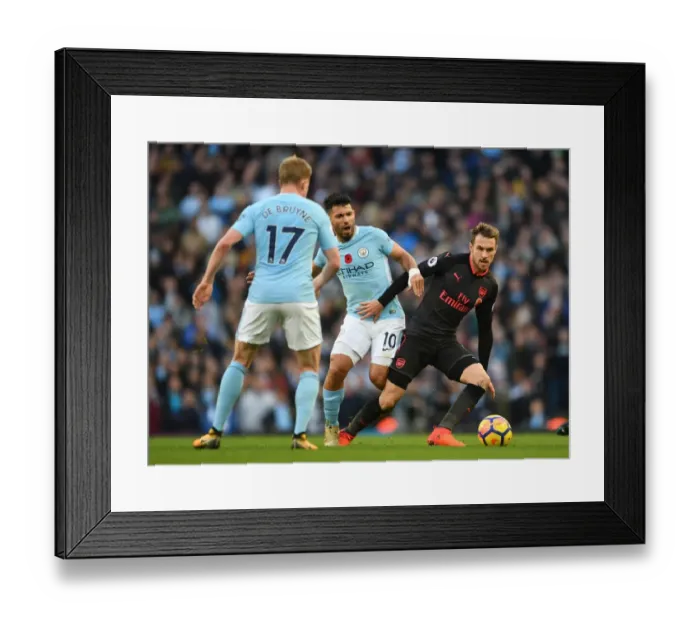 Framed Print : Ramsey Under Pressure: Sergio Aguero and Kevin De Bruyne Harass Arsenal Midfielder during Manchester City vs Arsenal Premier League Clash