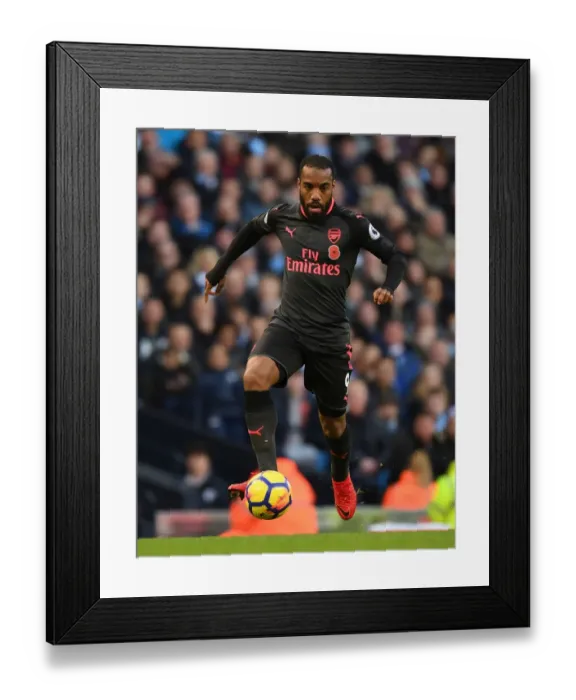 Framed Print : Alex Lacazette Faces Manchester City: Premier League Showdown (2017-18) Framed Print : Alex Lacazette Faces Manchester City: Premier League Showdown (2017-18)