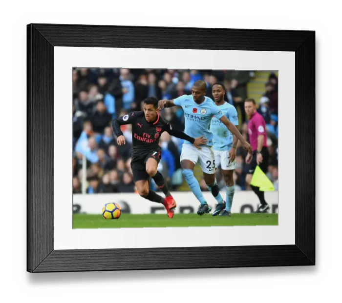 Framed Print : Arsenal's Alexis Sanchez vs Manchester City's Fernandinho: A Premier League Showdown