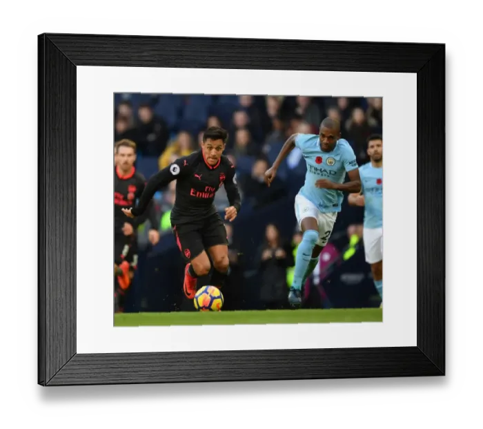 Framed Print : Alexis Sanchez vs. Fernandinho: A Premier League Battle at the Etihad