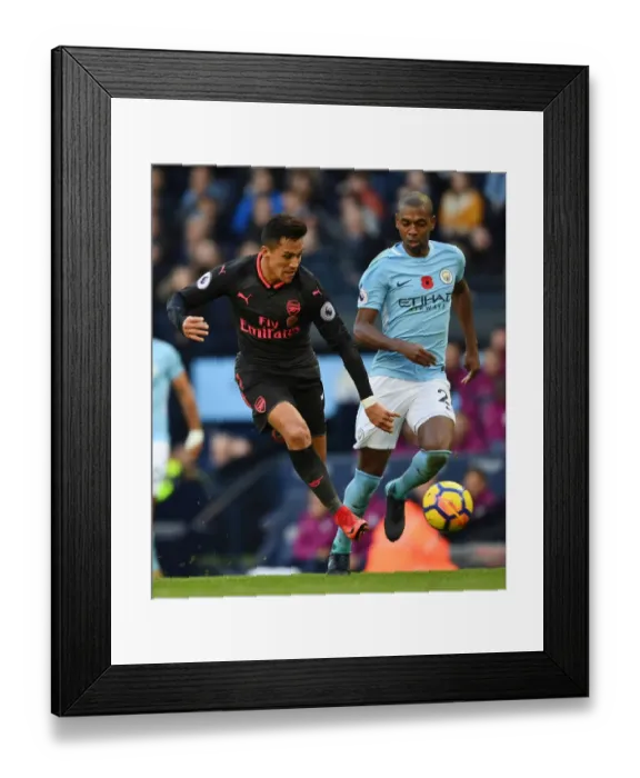Framed Print : Alexis Sanchez vs. Fernandinho: A Premier League Battle at the Etihad