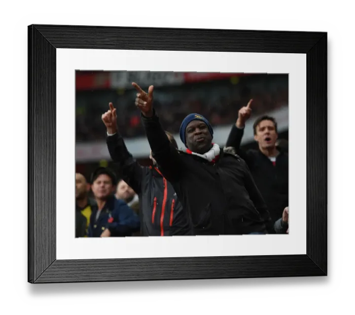 Framed Print : Passionate Arsenal Fan Amidst the Intense Arsenal vs. Tottenham Rivalry at Emirates Stadium