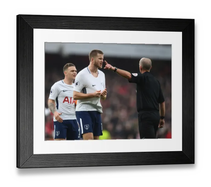 Framed Print : Mike Dean and Eric Dier: A Contentious Moment at the Emirates during Arsenal vs. Tottenham