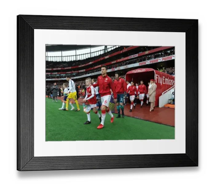 Framed Print : Arsenal's Laurent Koscielny Leads Team Out Against Tottenham in Premier League Clash Framed Print : Arsenal's Laurent Koscielny Leads Team Out Against Tottenham in Premier League Clash