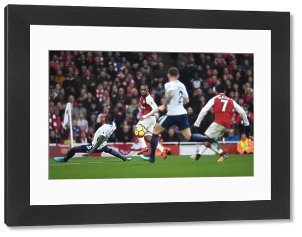 Alexandre Lacazette crosses the ball to Alexis Sanchez to score Arsenals 2nd goal