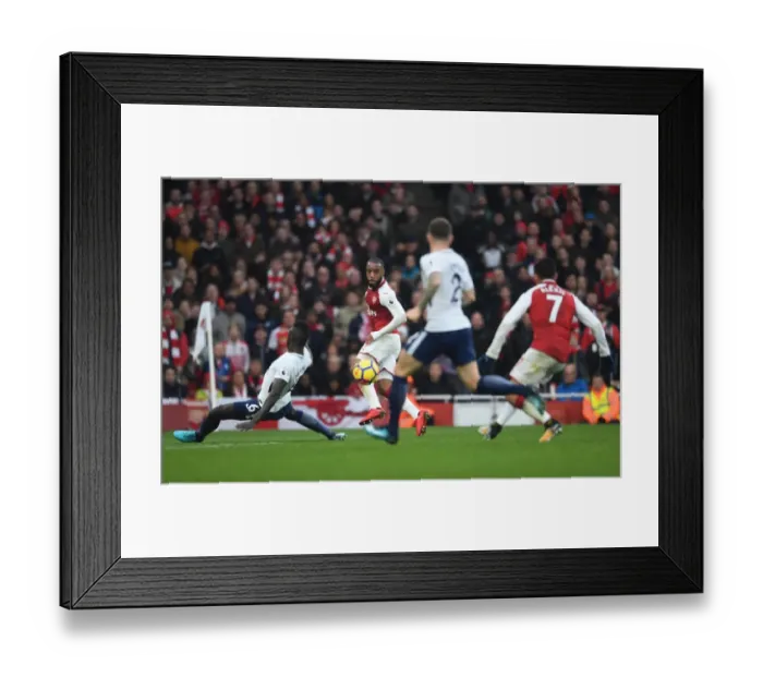 Framed Print : Alexandre Lacazette crosses the ball to Alexis Sanchez to score Arsenals 2nd goal