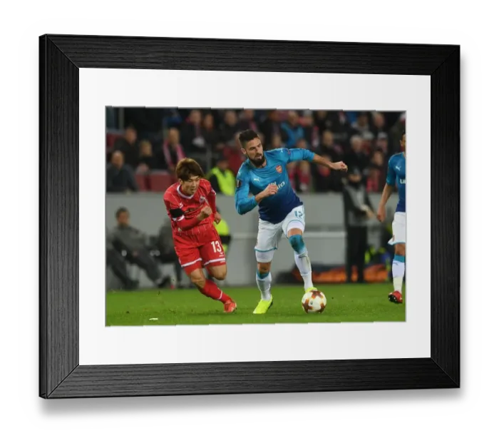 Framed Print : Giroud vs. Osako: Intense Battle in FC Koln vs. Arsenal UEFA Europa League Clash Framed Print : Giroud vs. Osako: Intense Battle in FC Koln vs. Arsenal UEFA Europa League Clash