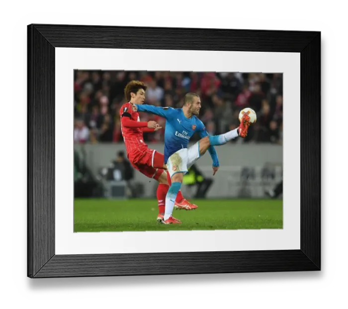 Framed Print : Jack Wilshere Faces Off Against Yuya Osako in Europa League Clash