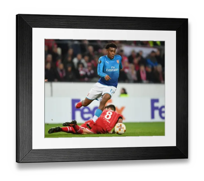 Framed Print : Alex Iwobi Outmaneuvers Milos Jojic in Arsenal's UEFA Europa League Clash against 1. FC Koln