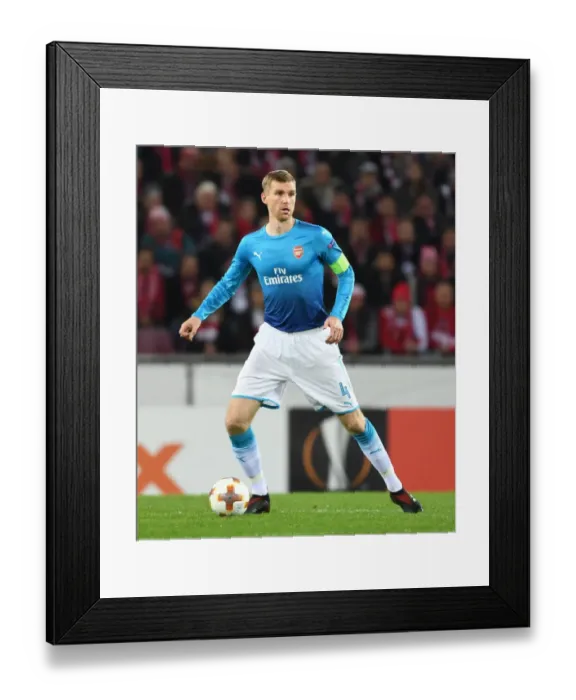 Framed Print : Per Mertesacker in Action: Arsenal vs. 1. FC Koln, UEFA Europa League (2017) Framed Print : Per Mertesacker in Action: Arsenal vs. 1. FC Koln, UEFA Europa League (2017)