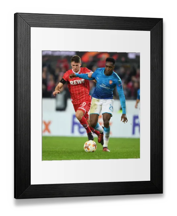 Framed Print : Danny Welbeck Outmaneuvers Salin Ozcan in Arsenal's UEFA Europa League Clash with 1. FC Koln Framed Print : Danny Welbeck Outmaneuvers Salin Ozcan in Arsenal's UEFA Europa League Clash with 1. FC Koln