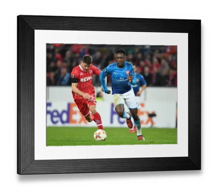 Framed Print : Danny Welbeck Dashes Past Salin Ozcan: Arsenal's Europa League Victory Against 1. FC Koln