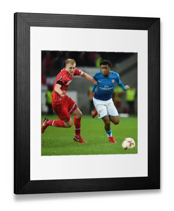 Framed Print : Alex Iwobi's Thrilling Dash Past Frederik Sorensen: A Memorable Moment in Arsenal's Europa League Victory Framed Print : Alex Iwobi's Thrilling Dash Past Frederik Sorensen: A Memorable Moment in Arsenal's Europa League Victory