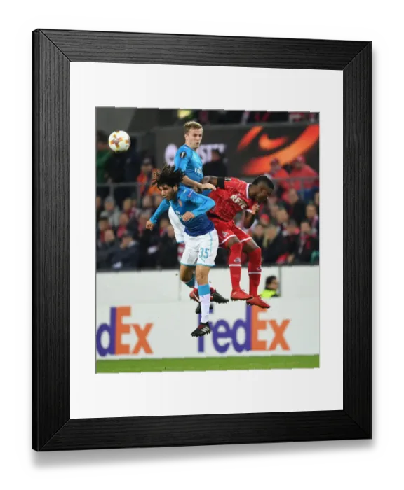 Framed Print : Elneny and Holding Lock Horns with Guirassy in Arsenal's Europa League Battle against FC Koln