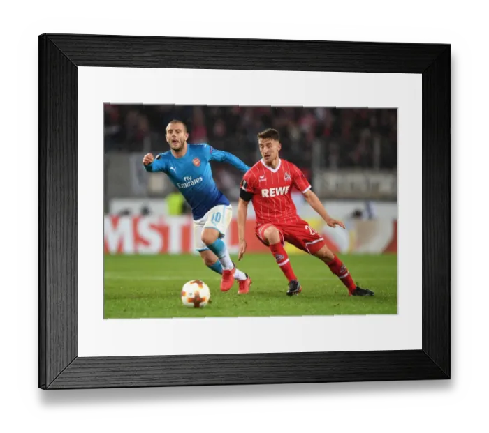 Framed Print : Jack Wilshere Outmaneuvers Salih Ozcan in Arsenal's UEFA Europa League Clash vs. 1. FC Koln Framed Print : Jack Wilshere Outmaneuvers Salih Ozcan in Arsenal's UEFA Europa League Clash vs. 1. FC Koln