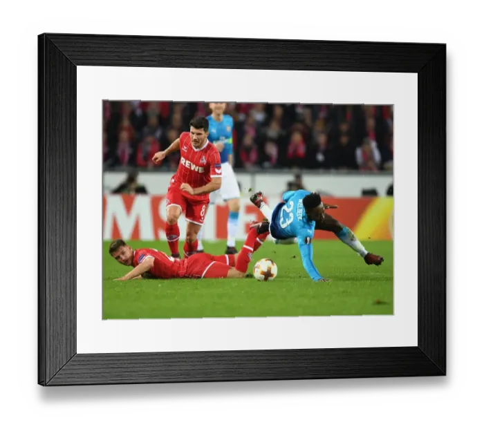 Framed Print : Danny Welbeck vs. Milos Mere: A Battle in the UEFA Europa League between Arsenal and 1. FC Koln Framed Print : Danny Welbeck vs. Milos Mere: A Battle in the UEFA Europa League between Arsenal and 1. FC Koln