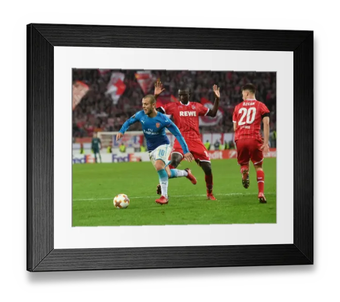 Framed Print : Jack Wilshere Clashes with Guirassy and Ozcan in Arsenal's Europa League Battle against FC Koln