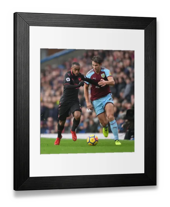 Framed Print : Clash at Turf Moor: Lacazette vs. Tarkowski in Premier League Showdown