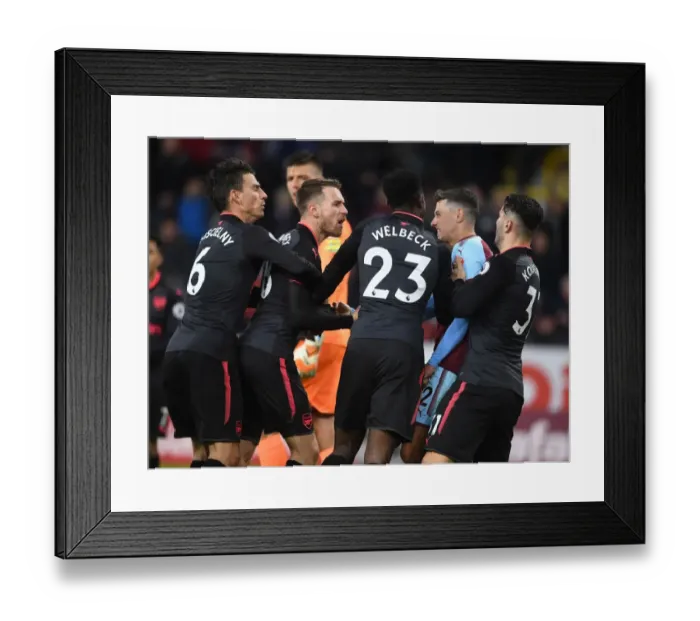 Framed Print : Aaron Ramsey and Matthew Lowton Clash in Intense Burnley vs. Arsenal Premier League Encounter
